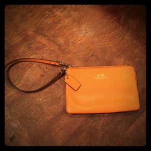Coach small wristlet, orange leather